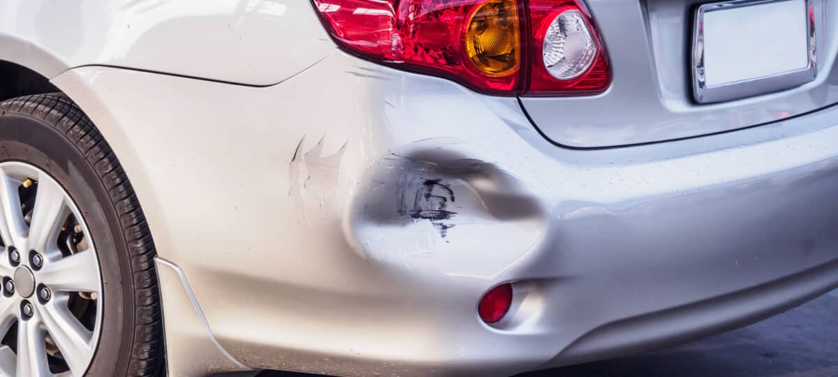 car has dented rear bumper damaged after accident