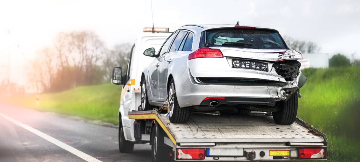 Damaged car on a tow truck.